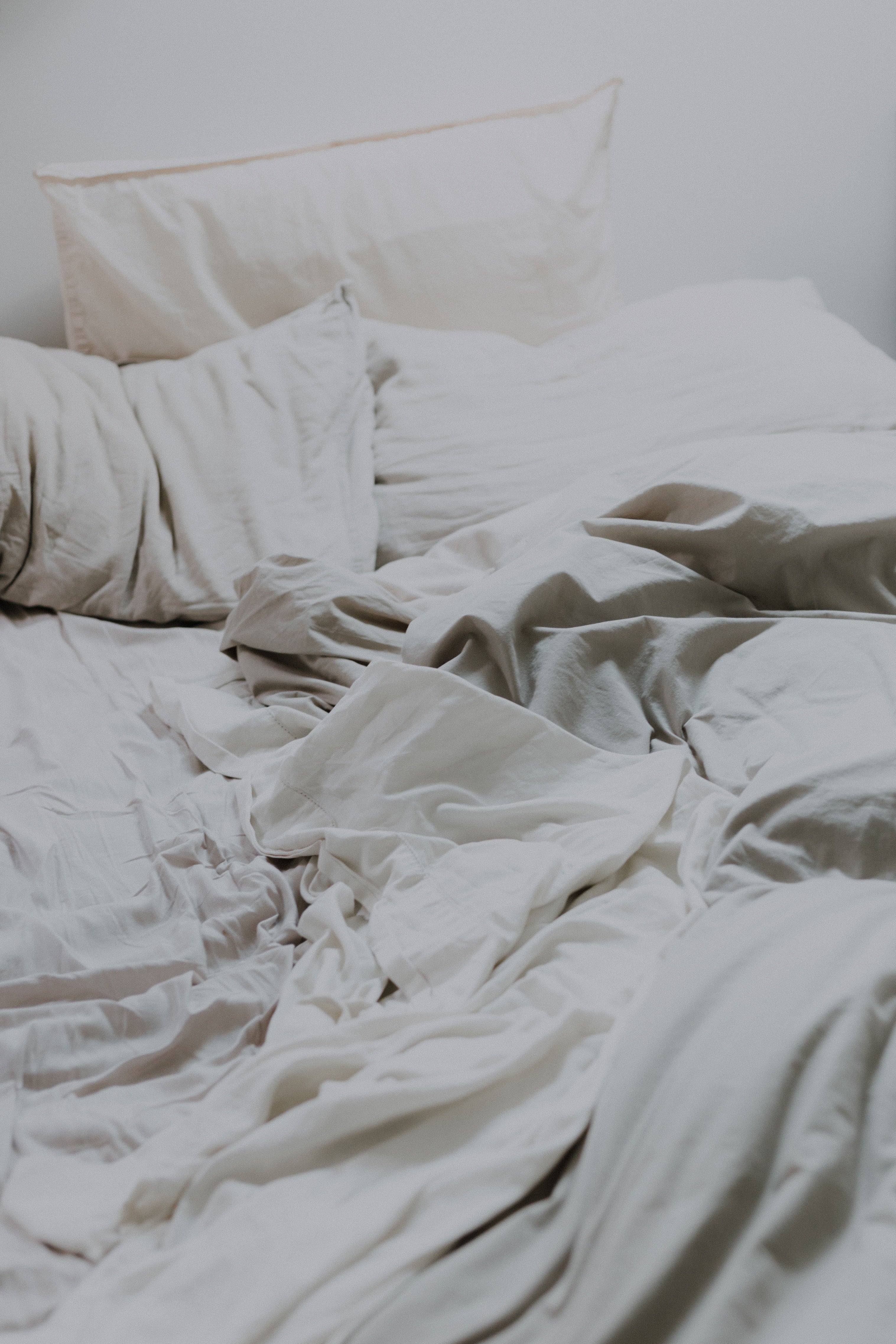 bed with crumpled duvet