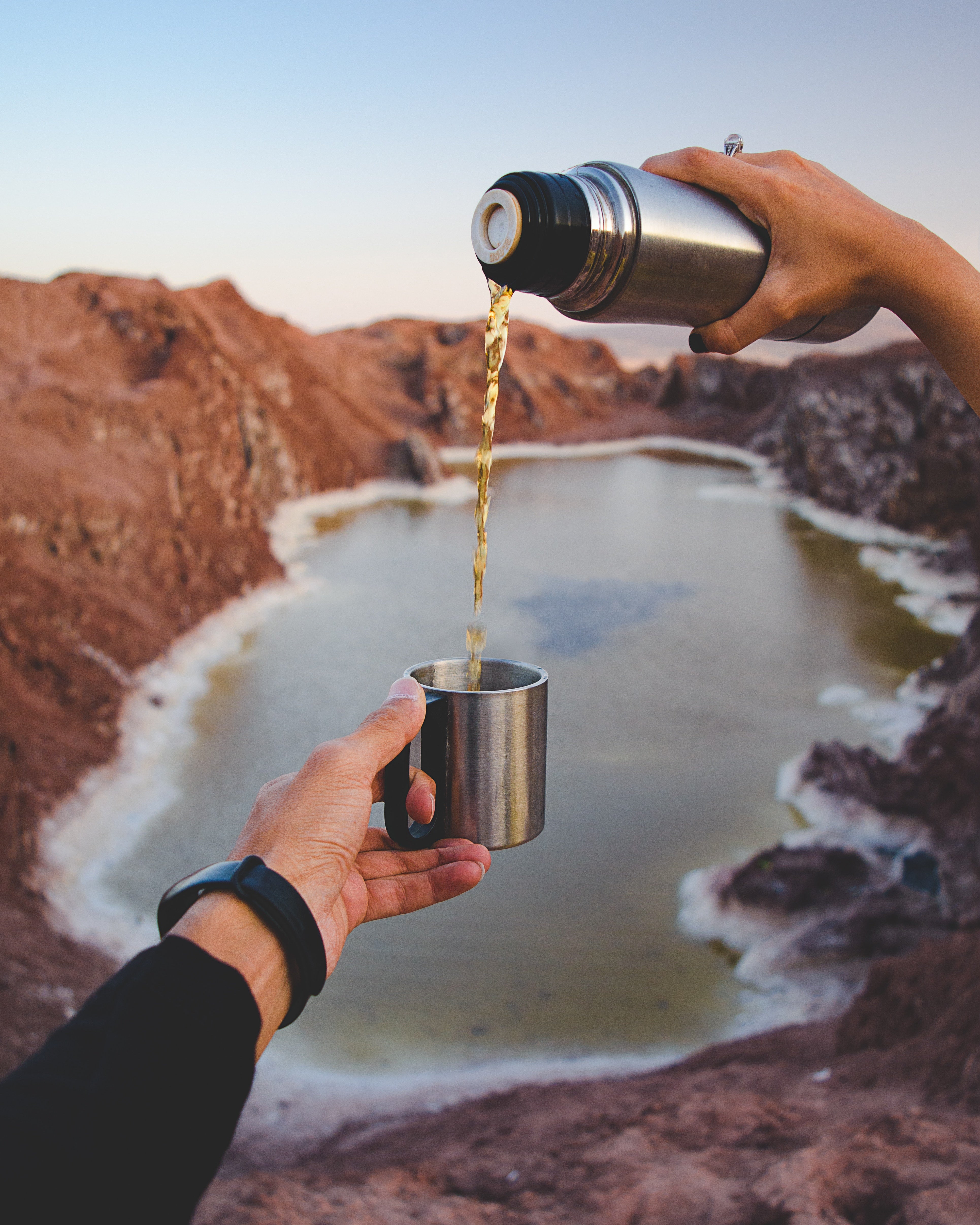 flask of tea over a valley