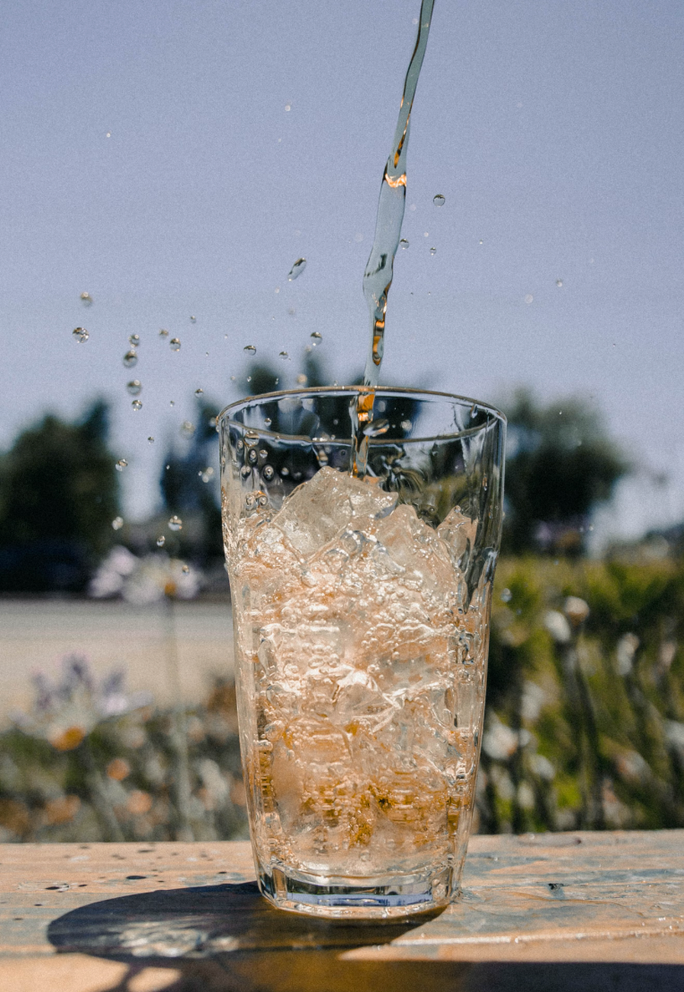 pouring natural ice-tea into a glass